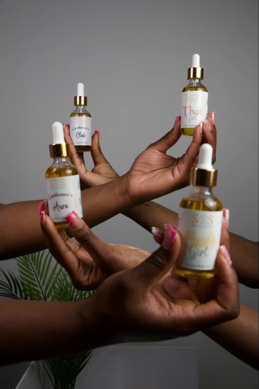 Hands holding Skin Out Secrets body oils